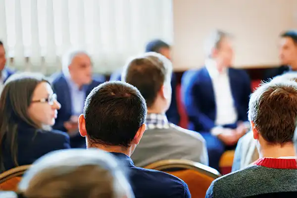 A group of people in conference.